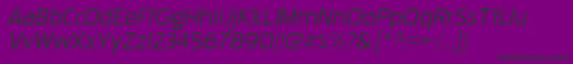 PakenhamxprgItalic-fontti – mustat fontit violetilla taustalla