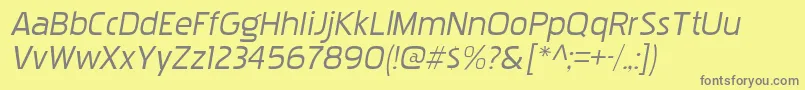 PakenhamxprgItalic-fontti – harmaat kirjasimet keltaisella taustalla