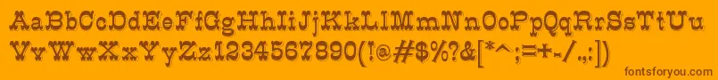 K22Eclair-Schriftart – Braune Schriften auf orangefarbenem Hintergrund