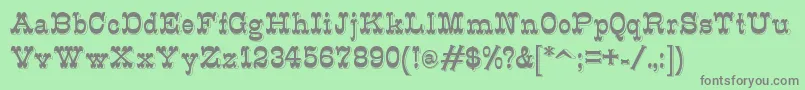 フォントK22Eclair – 緑の背景に灰色の文字