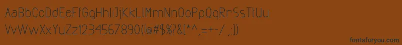 フォントExactaBold – 黒い文字が茶色の背景にあります