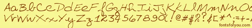 フォントVillaRegular – 茶色の文字が黄色の背景にあります。