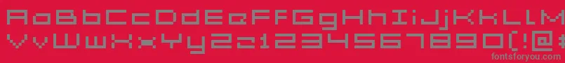 フォントAcme5WideXtnd – 赤い背景に灰色の文字