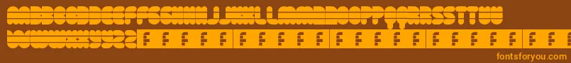 フォントDiscoFlow – オレンジ色の文字が茶色の背景にあります。