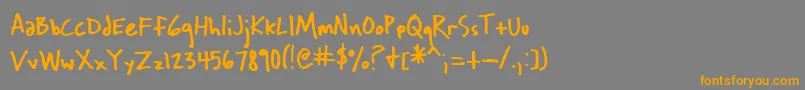 フォントWichita – オレンジの文字は灰色の背景にあります。