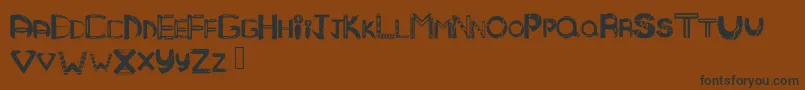 Mandmtribal Font – Black Fonts on Brown Background