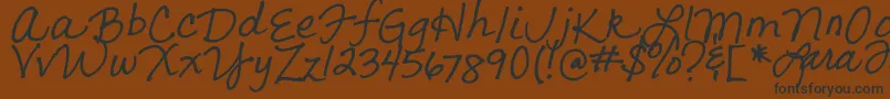 LarasLetters Font – Black Fonts on Brown Background