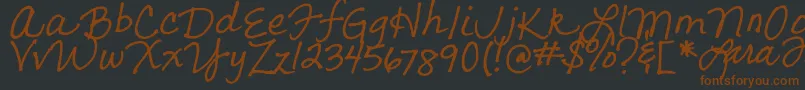 LarasLetters Font – Brown Fonts on Black Background