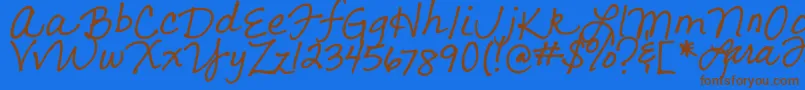 フォントLarasLetters – 茶色の文字が青い背景にあります。