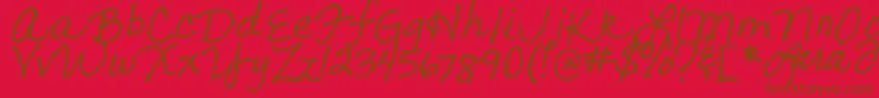 フォントLarasLetters – 赤い背景に茶色の文字
