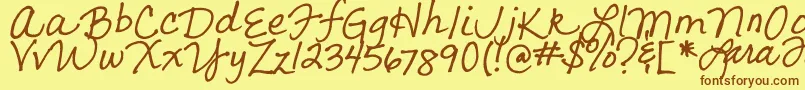フォントLarasLetters – 茶色の文字が黄色の背景にあります。