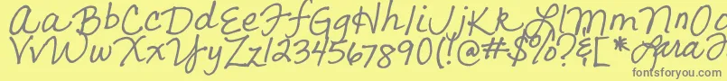 フォントLarasLetters – 黄色の背景に灰色の文字