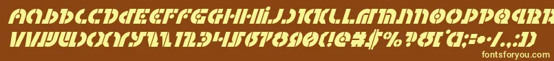 Questloksuperital-fontti – keltaiset fontit ruskealla taustalla