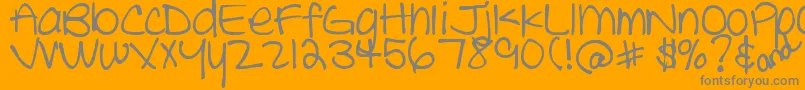 DjbTheCheerleader-fontti – harmaat kirjasimet oranssilla taustalla