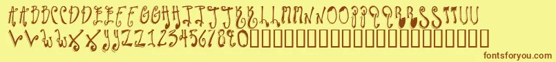 フォントTwilightExpress – 茶色の文字が黄色の背景にあります。