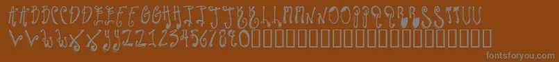 TwilightExpress-fontti – harmaat kirjasimet ruskealla taustalla