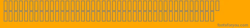 Flyman-fontti – harmaat kirjasimet oranssilla taustalla