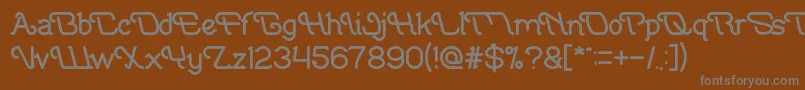 IndonesiaTanahAirBeta-fontti – harmaat kirjasimet ruskealla taustalla