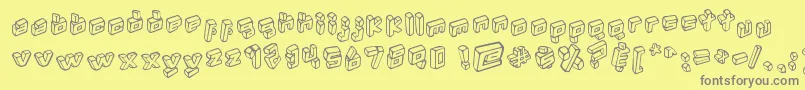 Kotak-fontti – harmaat kirjasimet keltaisella taustalla