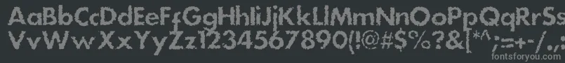 フォントDsstainc – 黒い背景に灰色の文字