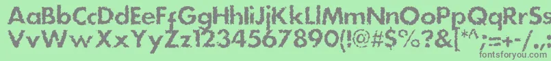 Dsstainc-fontti – harmaat kirjasimet vihreällä taustalla