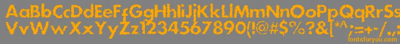 フォントDsstainc – オレンジの文字は灰色の背景にあります。