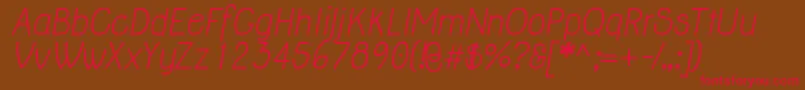 JollyItalic-fontti – punaiset fontit ruskealla taustalla
