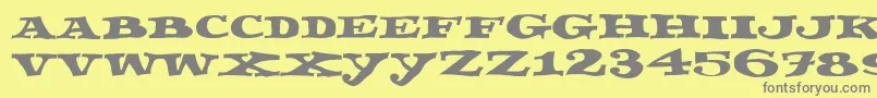 Fettecke-fontti – harmaat kirjasimet keltaisella taustalla
