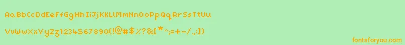 フォントPixelMaz – オレンジの文字が緑の背景にあります。