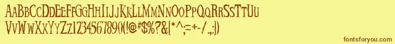 フォントDemonNight – 茶色の文字が黄色の背景にあります。