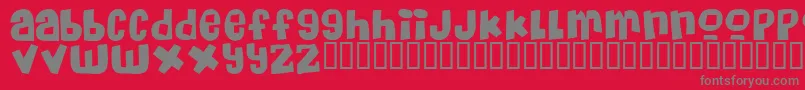 フォントMassiveHeadacheii – 赤い背景に灰色の文字