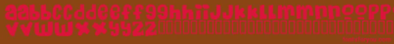 フォントMassiveHeadacheii – 赤い文字が茶色の背景にあります。