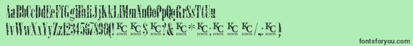 Fonte LoadupongunsKcfontsdemo – fontes pretas em um fundo verde