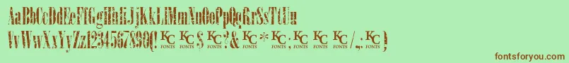 LoadupongunsKcfontsdemo-Schriftart – Braune Schriften auf grünem Hintergrund