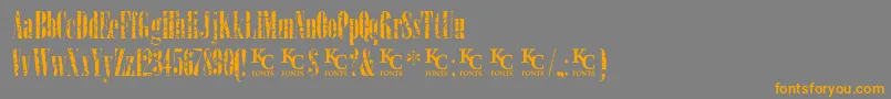 LoadupongunsKcfontsdemo-Schriftart – Orangefarbene Schriften auf grauem Hintergrund