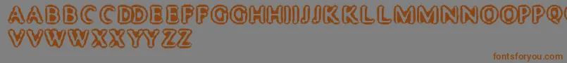 Weitere Informationen zur MisterHaddaris-Schriftart MisterHaddaris-Schriftart – Braune Schriften auf grauem Hintergrund
