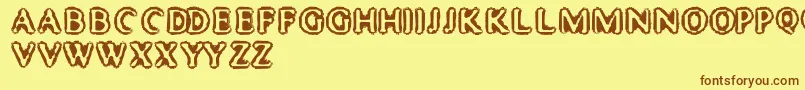 フォントMisterHaddaris – 茶色の文字が黄色の背景にあります。