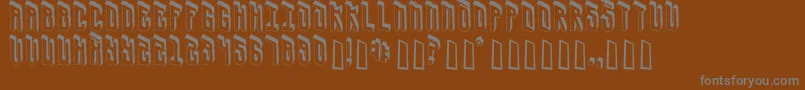 UrsaCape-fontti – harmaat kirjasimet ruskealla taustalla