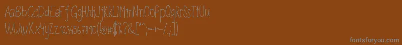 Upirpaw Font – Gray Fonts on Brown Background