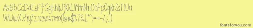 Upirpaw-Schriftart – Graue Schriften auf gelbem Hintergrund