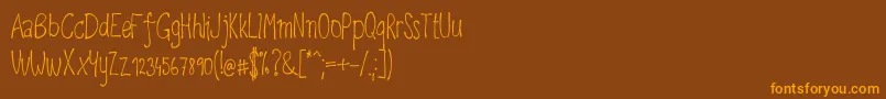 Upirpaw Font – Orange Fonts on Brown Background