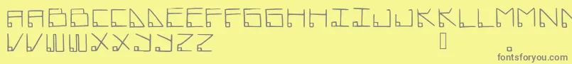 フォントDatamost – 黄色の背景に灰色の文字