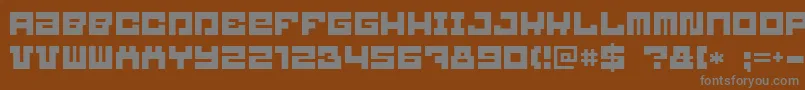Blockbit-fontti – harmaat kirjasimet ruskealla taustalla