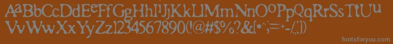 Romaa-Schriftart – Graue Schriften auf braunem Hintergrund