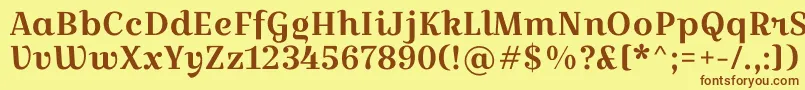 フォントCroissantoneRegular – 茶色の文字が黄色の背景にあります。