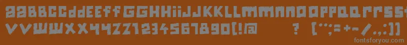 Jiczyn-fontti – harmaat kirjasimet ruskealla taustalla