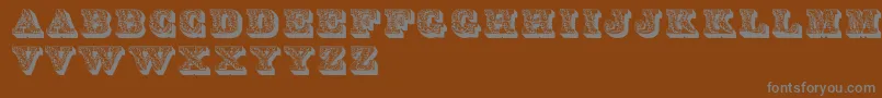 Lettresombreesornees-Schriftart – Graue Schriften auf braunem Hintergrund