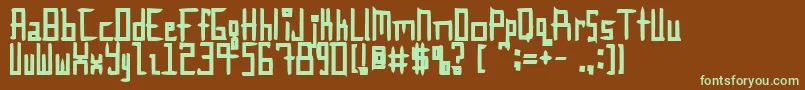 フォントInnieOuttie – 緑色の文字が茶色の背景にあります。