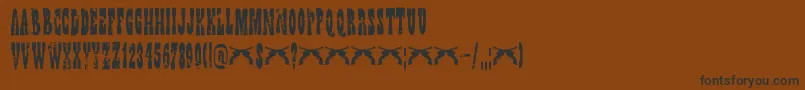 Fonte DkWildBunch – fontes pretas em um fundo marrom