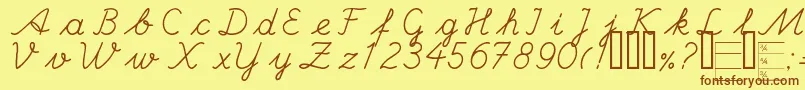 フォントHandc – 茶色の文字が黄色の背景にあります。